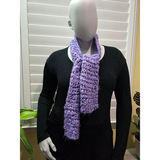 Purple fuzzy knit scarf tied at the neck