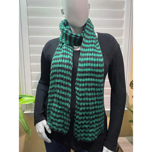 Green and black striped knit scarf wrapped at the neck