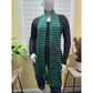 Green and black striped knit scarf worn on mannequin