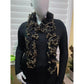 Black and gold ruffled scarf styled around the neck