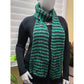 Green and black ribbed knit scarf styled loose